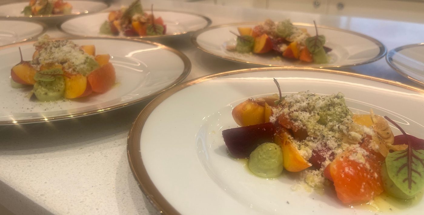 Heirloom beetroot, stone fruit and avocado salad plated for guest service by chef Troy Davidson