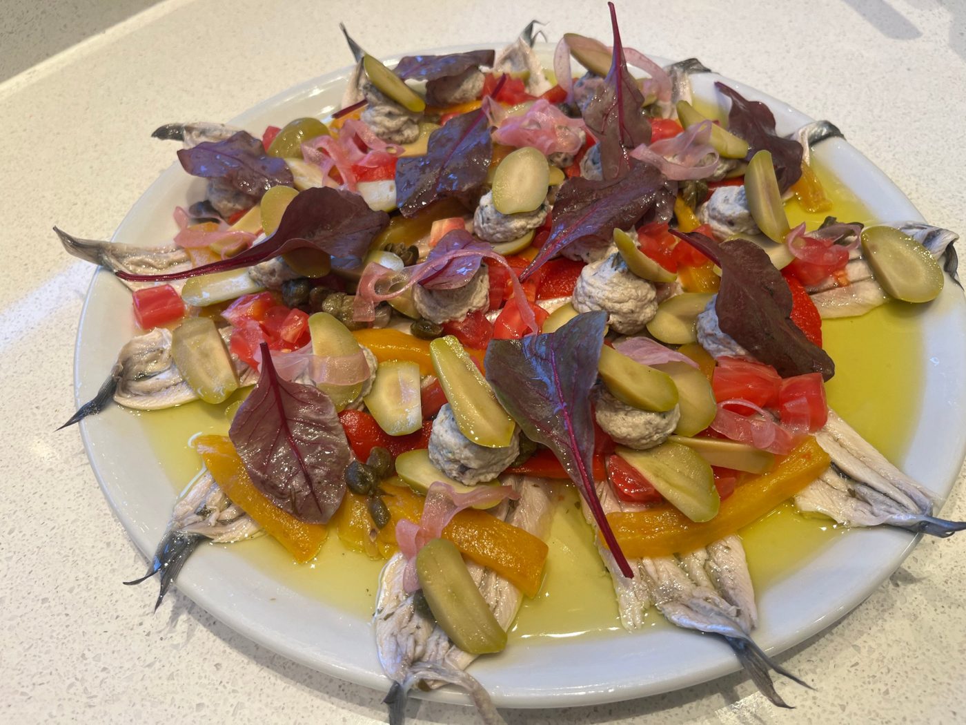 White anchovies with roasted peppers, olives, capers and pickled shallot by chef Troy Davidson
