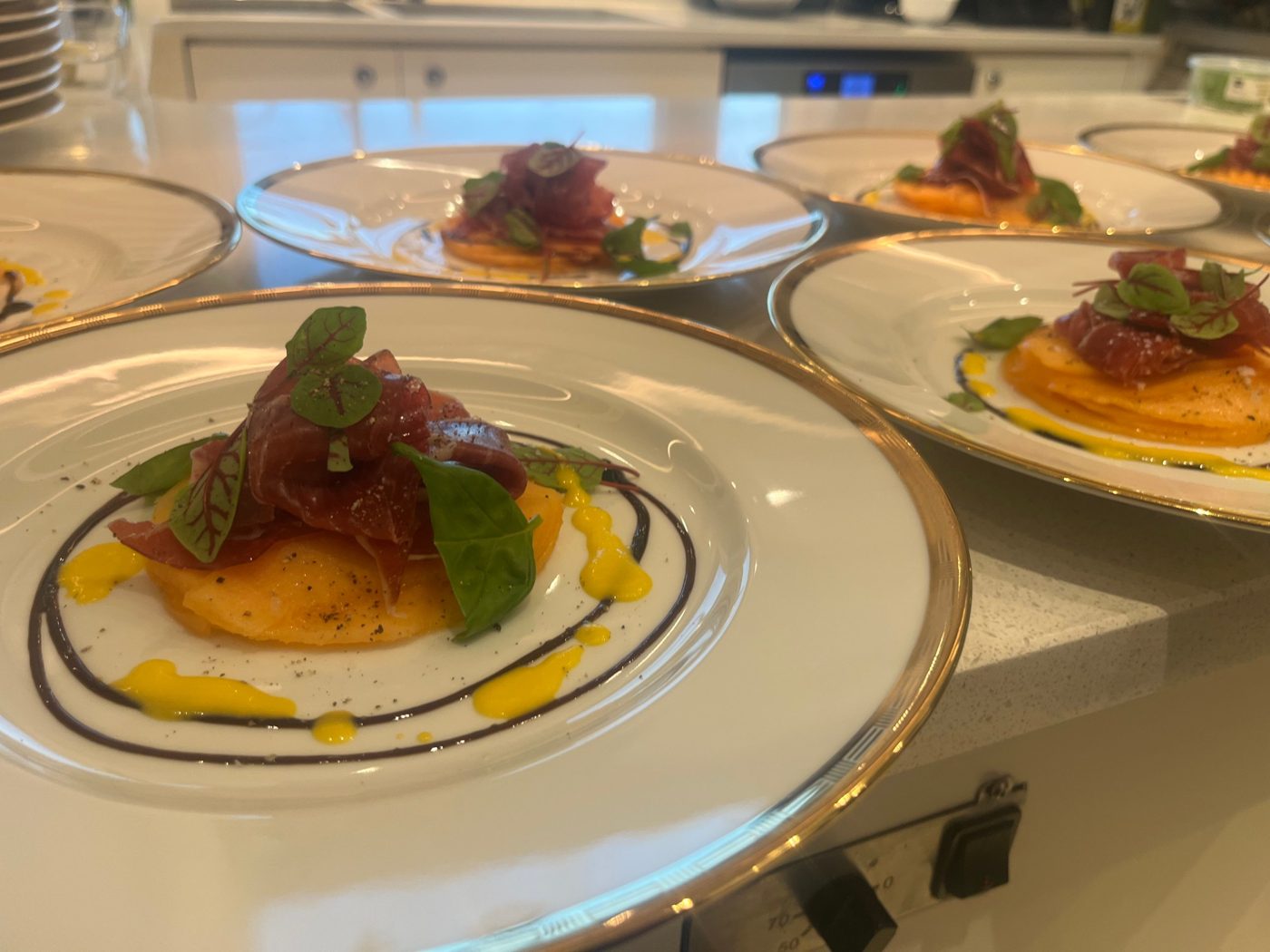 Cured beef over melon carpaccio with saffron and balsamic, fine dining at sea by chef Troy Davidson